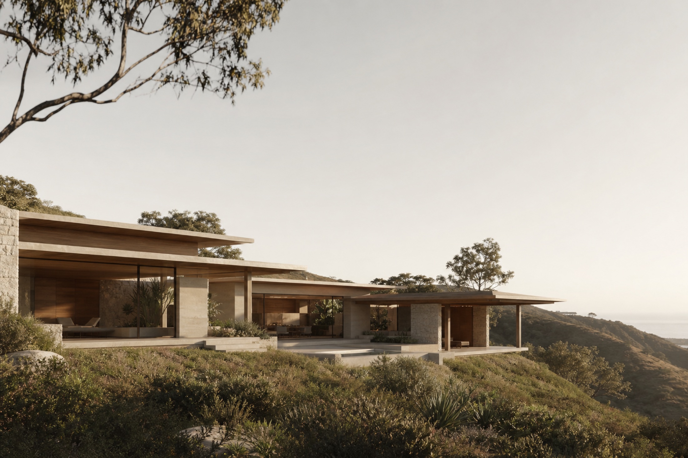 The Ridge House, a low stone residence set into a green hillside.